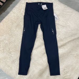 Navy blue workout leggings, size small, brand is XERSION, 7/8 ankle